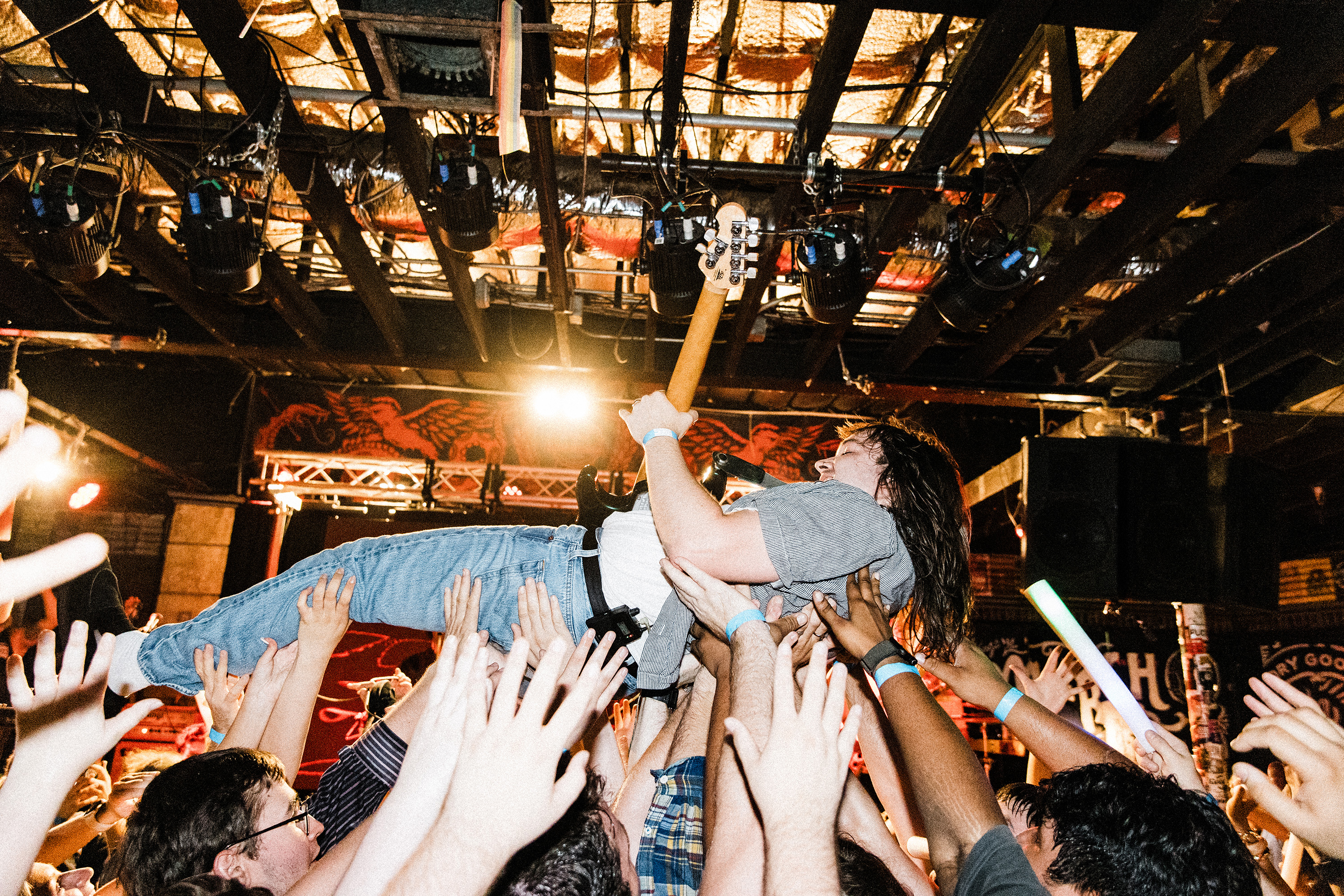 Rohna guitarist John crowdsurfs while playing.